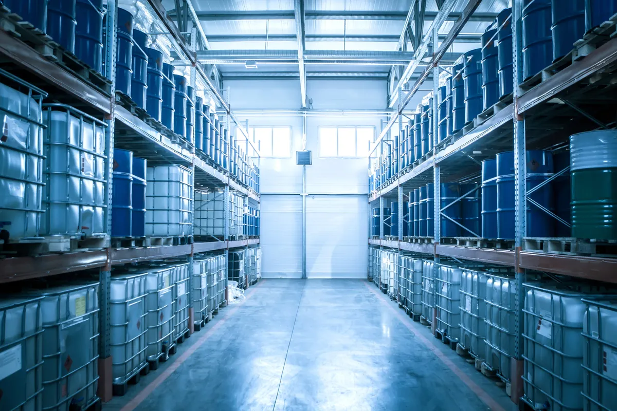 Chemical drums in an industrial warehouse